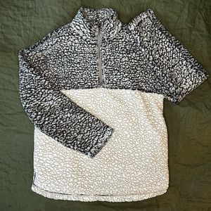Women’s half zip sweater.